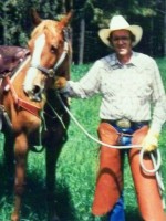 Author Stephen Bly with horse and chaps