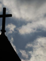 The cross on the steeple of St. Francis Xavier Catholic Church in Henryville, Ind. A recent Gallup poll says only 44 percent of Americans have "great confidence" in organized religion.